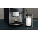 Siemens Glass milk container 0.7 l (TZ80008) next to a coffee machine, transparent glass container with black lid and connector.