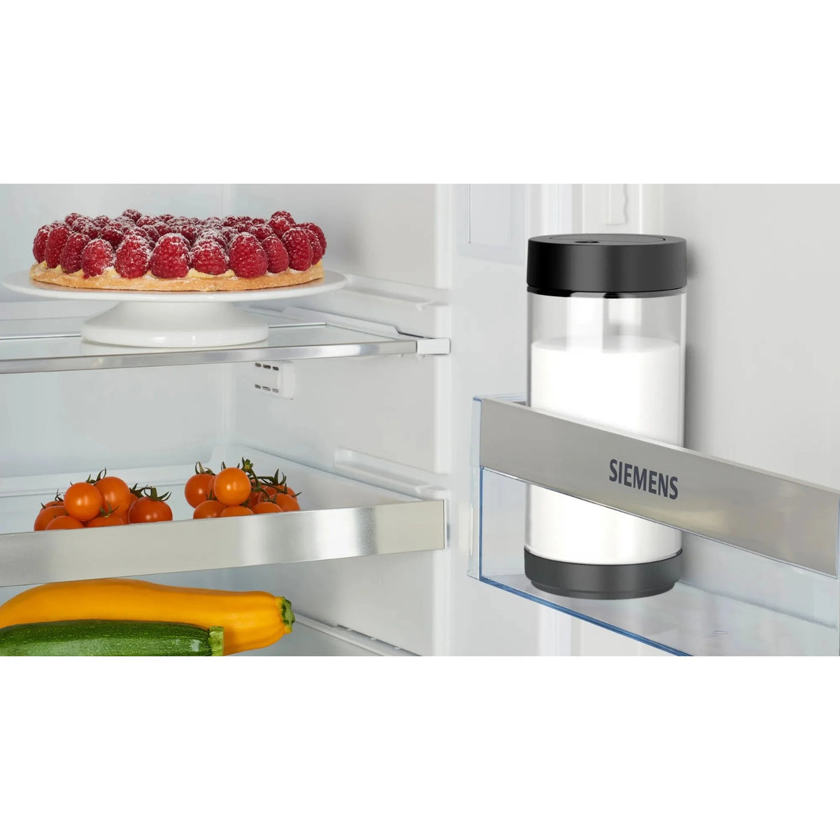 Siemens Glass milk container 0.7 l (TZ80008) glass reservoir with black lid placed in the fridge door shelf, filled.