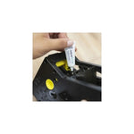 Aquafloow food-grade silicone lubricant for coffee machine maintenance (5 g) - tube applied into a plastic part of a coffee machine, hand visible