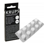 Čierne balenie KRUPS Cleaning Tablets XS3000 vedľa strieborneho blistra s desiatimi okrúhlymi bielymi tabletami